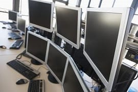 Empty office space with many monitors